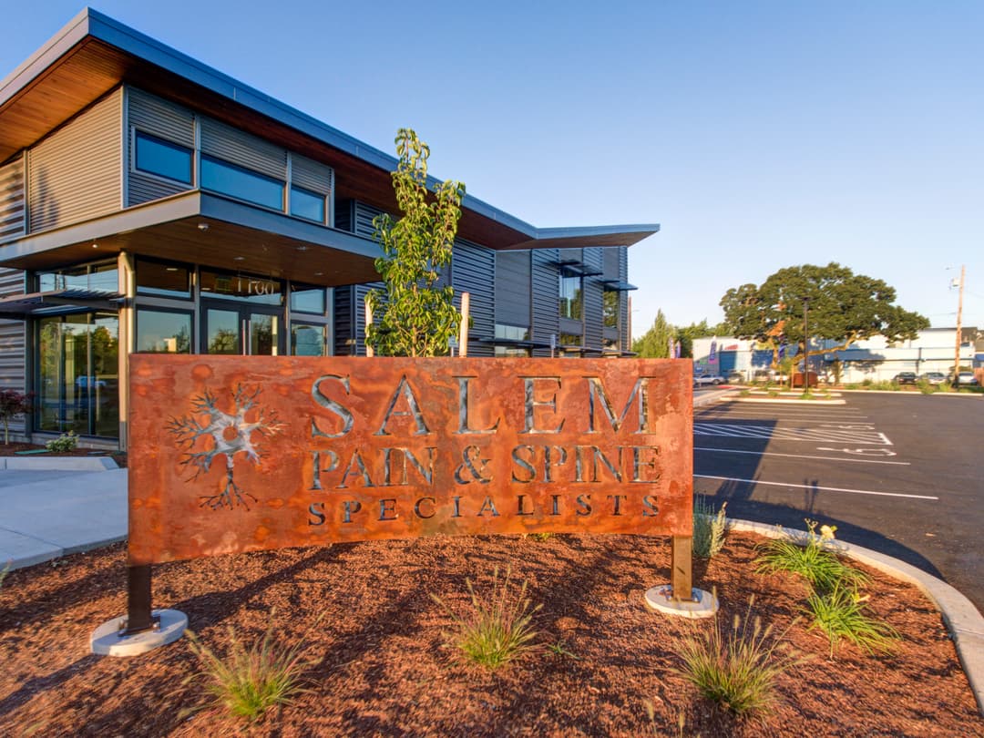 Salem Pain & Spine Specialists building with modern architecture and landscaped entrance.