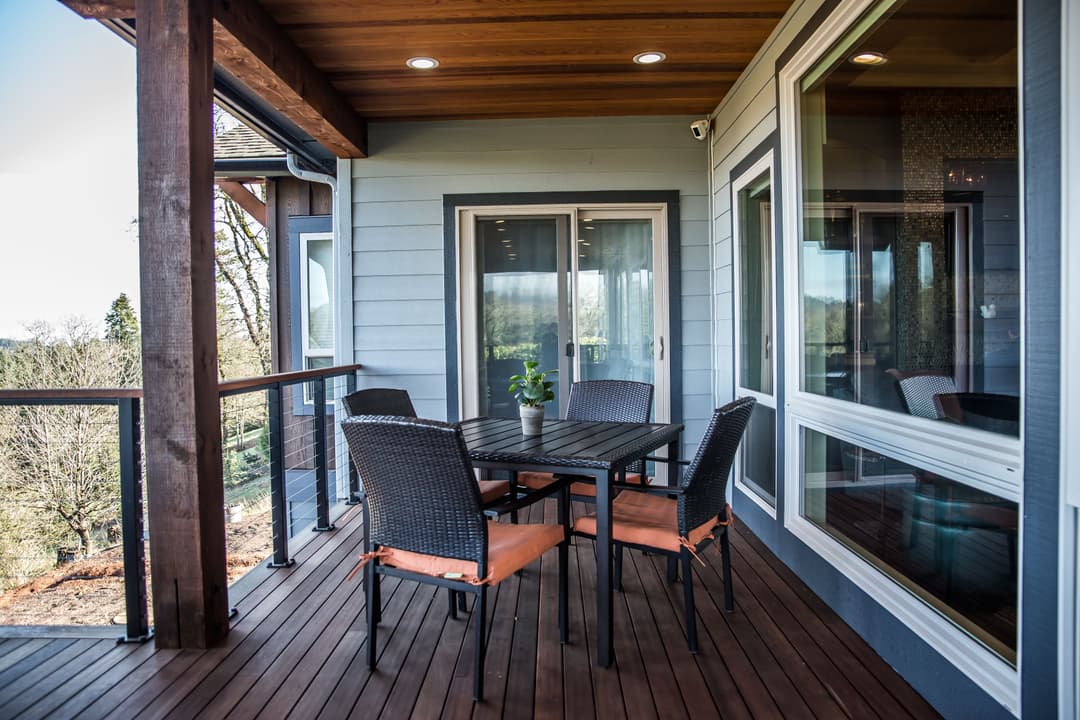 Elegant outdoor patio with modern furniture, scenic views, and natural lighting. Perfect for relaxation.