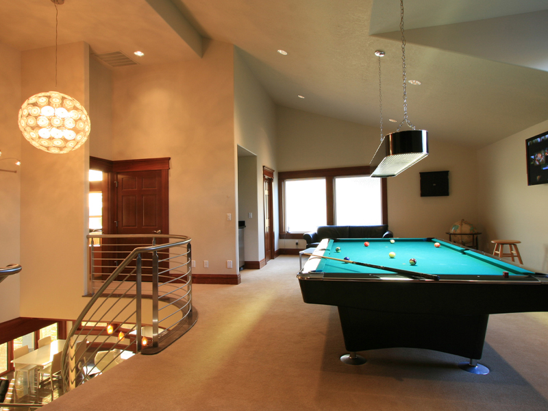 a living room filled with furniture and a flat screen tv