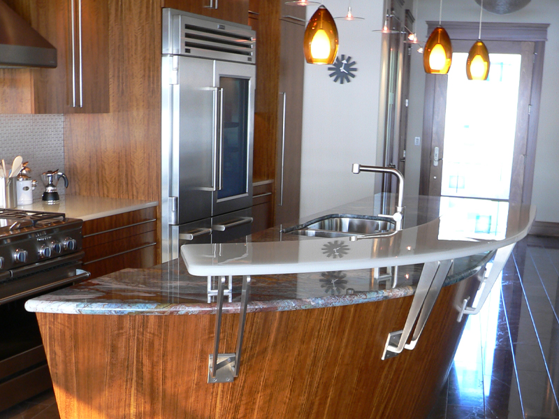 a modern kitchen with stainless steel appliances and wooden cabinets