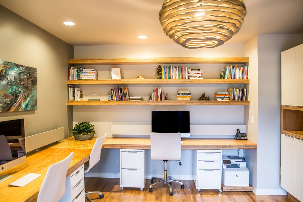 a living room filled with furniture and a flat screen tv