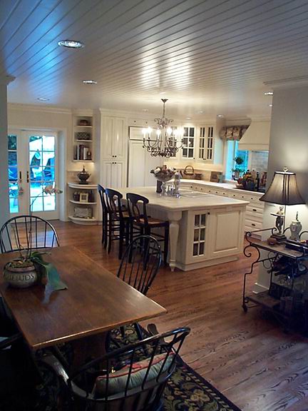 a living room filled with furniture and a fireplace