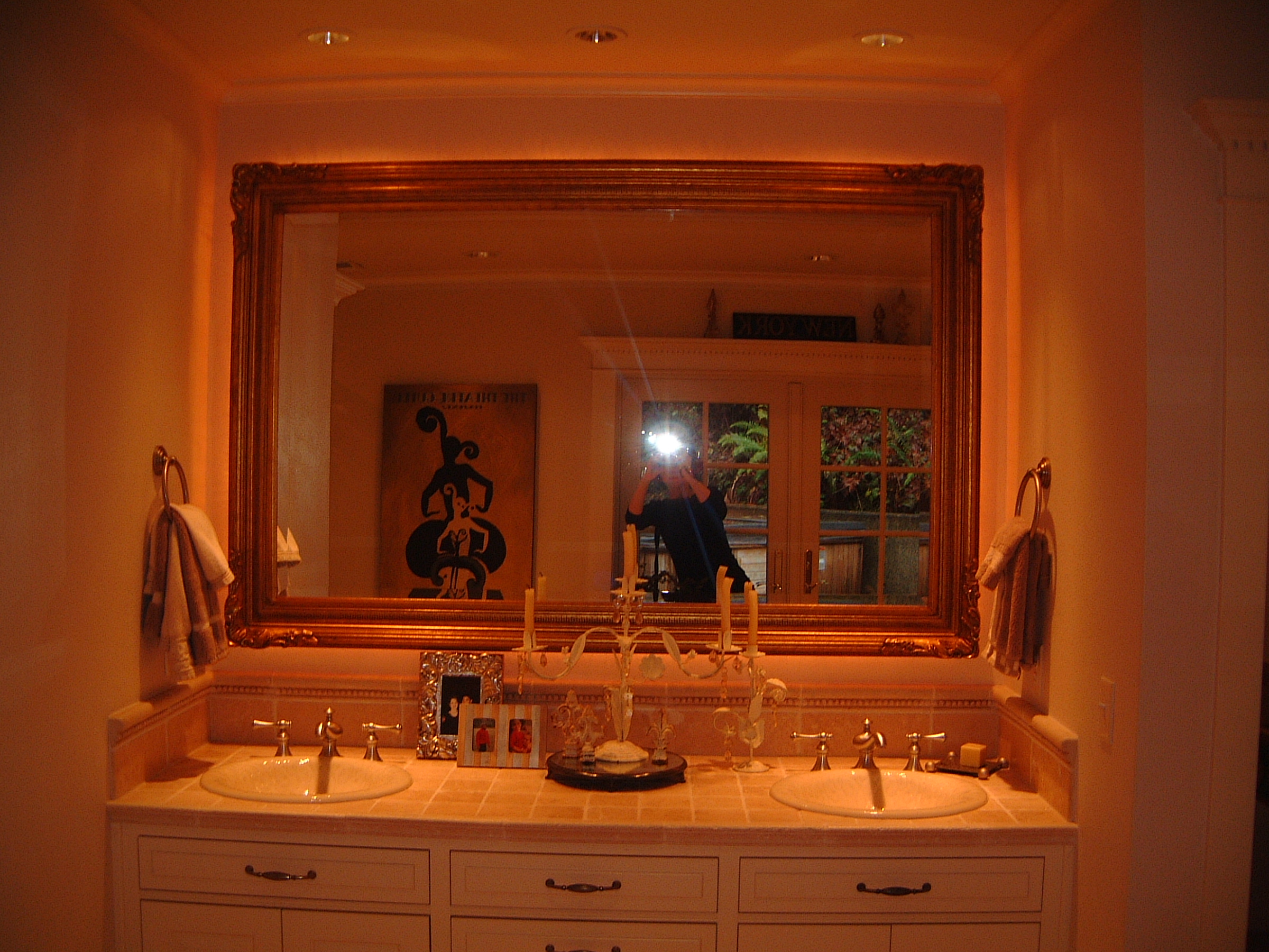 a kitchen with a sink and a mirror