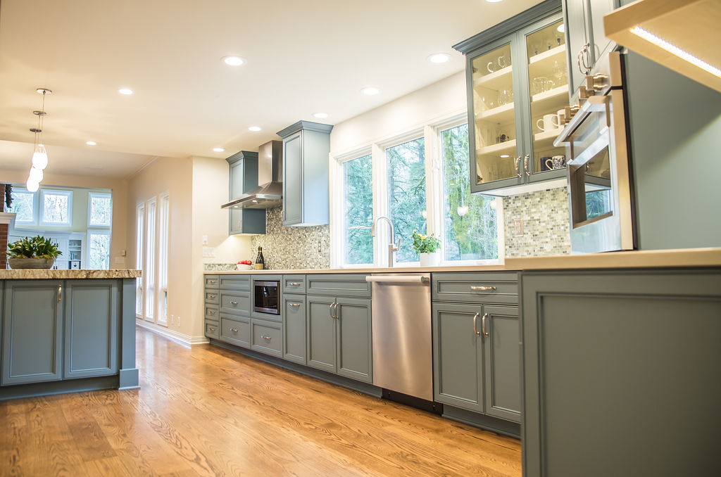 a kitchen with a sink and a large window