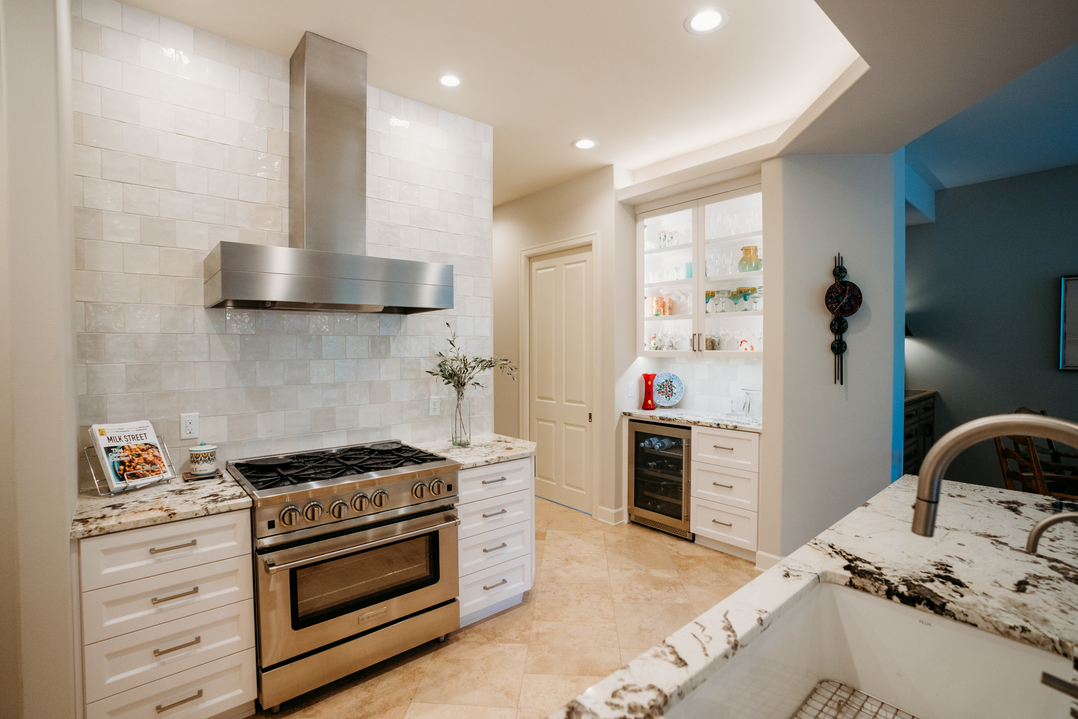 a kitchen with a stove and a sink