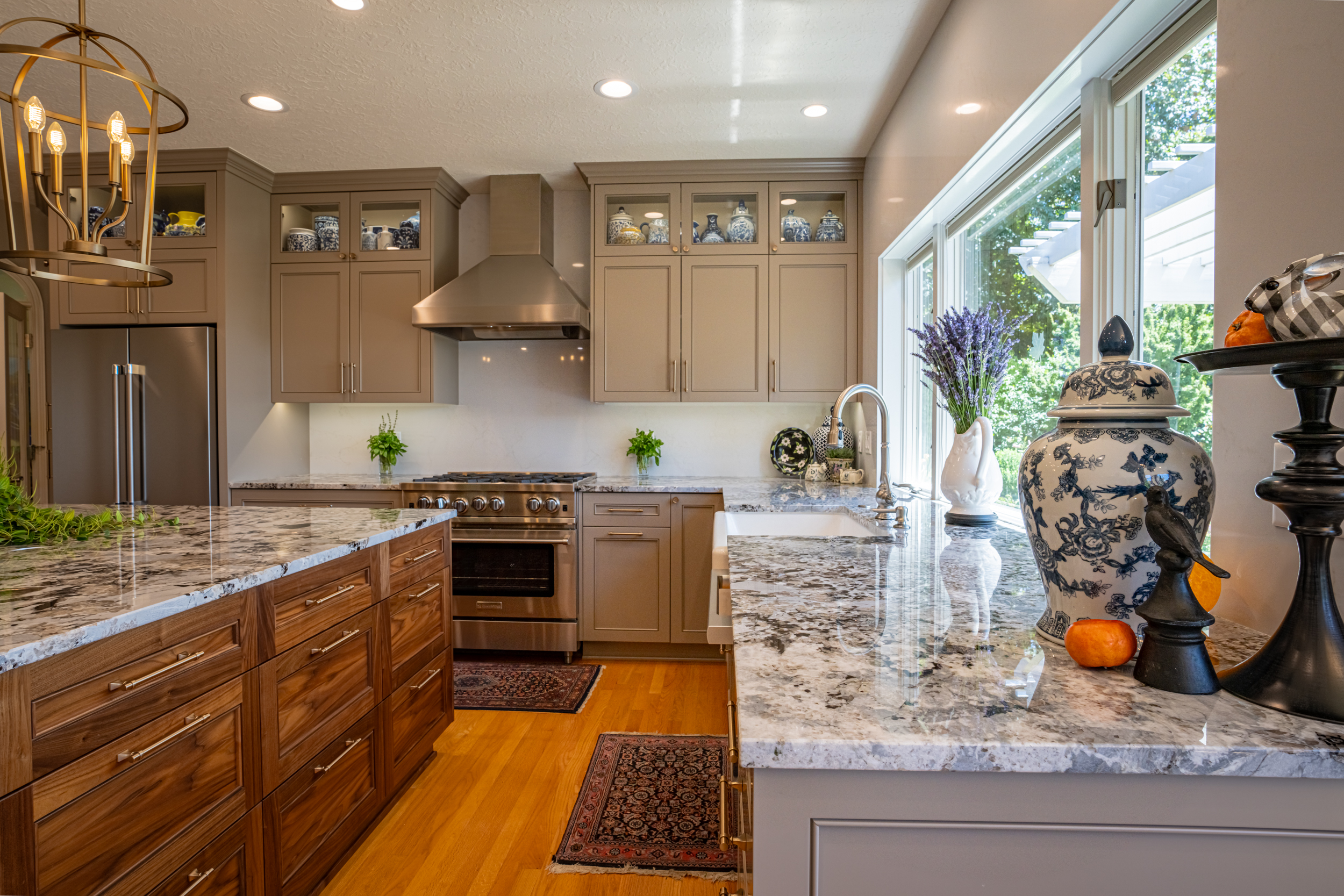 a large kitchen with stainless steel appliances and wooden cabinets