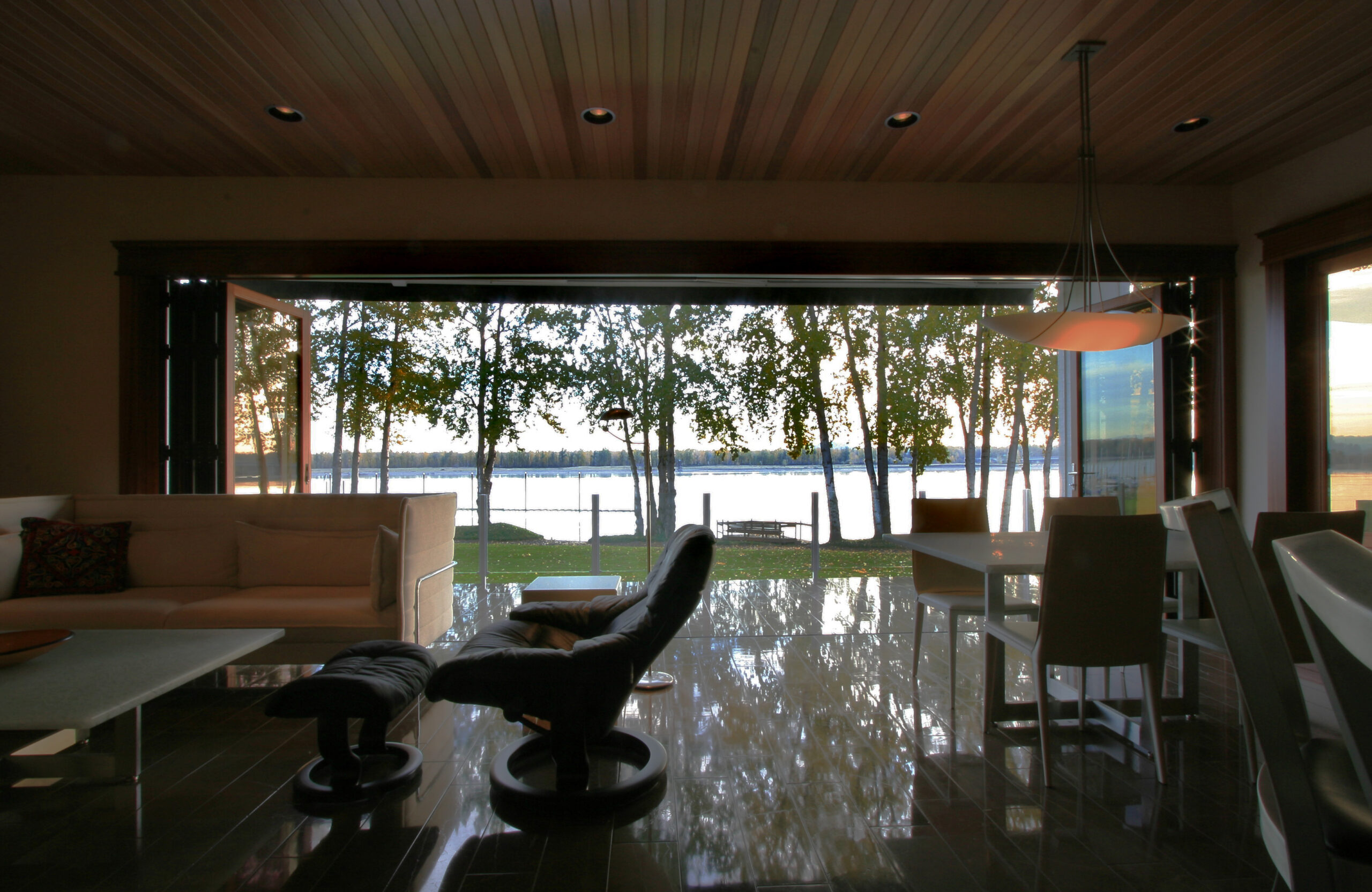 a living room filled with furniture and a large window