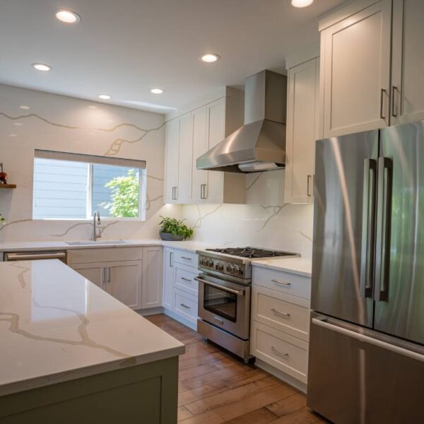 A Modern Kitchen With Stainless Steel Appliances