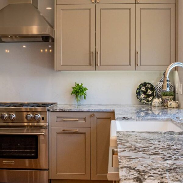 A Stove Top Oven Sitting Inside Of A Kitchen